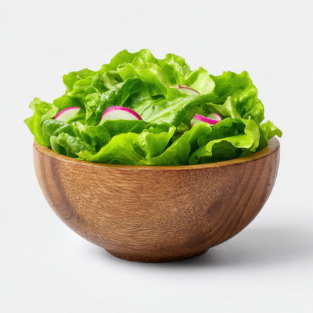 A vibrant green salad featuring crisp lettuce and colorful radishes presented in a rustic wooden bowl, perfect for healthy meals or fresh recipes.の素材