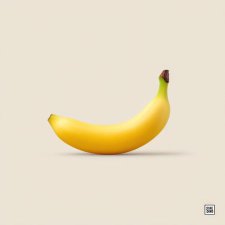 A vibrant yellow banana resting on a clean, neutral background. Perfect for illustrating concepts of health, nutrition, and simplicity in design.の素材