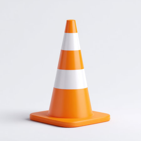 This image features a bright orange traffic cone with white reflective stripes, ideal for use in construction and safety contexts. Perfect for illustrating caution and visibility.の素材