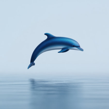 A vibrant dolphin gracefully leaps above the calm ocean waters, showcasing its agility and beauty in a serene marine setting, evoking a sense of freedom.の素材