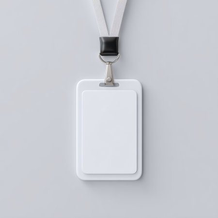 A clean and minimalistic layout featuring a blank ID card attached to a lanyard against a plain background. Ideal for showcasing identity solutions or event credentials.の素材