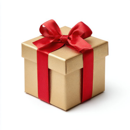 This elegant golden gift box adorned with a vibrant red ribbon captures the essence of joy and generosity, making it ideal for various celebrations.の素材