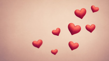 A beautiful arrangement of floating red hearts against a soft background, symbolizing love and affection. Perfect for use in romantic designs and greetings.の素材