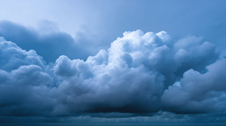 Experience the tranquility of majestic blue clouds forming in a serene sky, perfect for themes of nature and weather. This atmospheric scene captures the beauty and depth of the sky.の素材