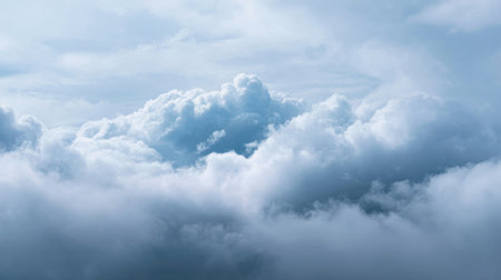 Expansive view of soft blue sky filled with fluffy clouds creating a serene atmosphere, perfect for relaxation or inspiration in natural settings.の素材