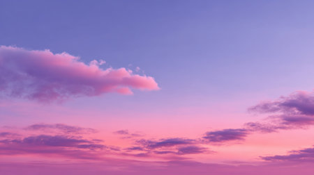 A breathtaking view of a sunset sky showcasing a blend of soft pink and purple clouds. This serene scene evokes calmness and beauty in nature.の素材