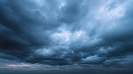 An expansive view of dark clouds swirling across a tranquil horizon during dusk, creating a captivating atmosphere perfect for dramatic themes in various projects.の素材