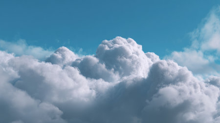 A stunning view of soft white clouds contrasted against a bright blue sky, capturing a serene atmosphere perfect for relaxation and nature-themed projects.の素材