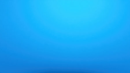 A vibrant blue background with a soft gradient effect, perfect for enhancing creative projects and modern designs. This versatile image adds a calming and inviting touch.の素材