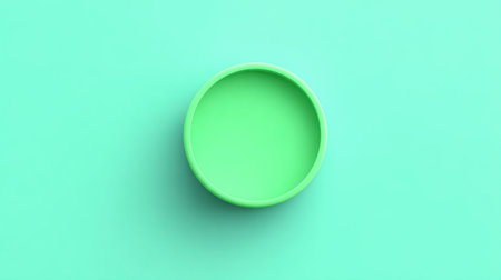 This image features a minimalistic green dish set against a soft mint background, perfect for emphasizing modern aesthetics in table settings or food presentations.の素材