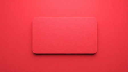 A vibrant red background featuring a smooth rectangular blank card. Perfect for showcasing designs in minimalist and modern projects.の素材