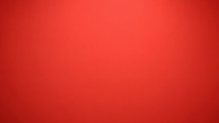 A vivid red background providing a smooth texture, perfect for creative projects, presentations, and graphic designs looking for a bold touch.の素材