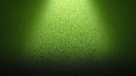 This bright green textured background features a captivating spotlight effect, perfect for various creative projects, presentations, or artistic endeavors.の素材