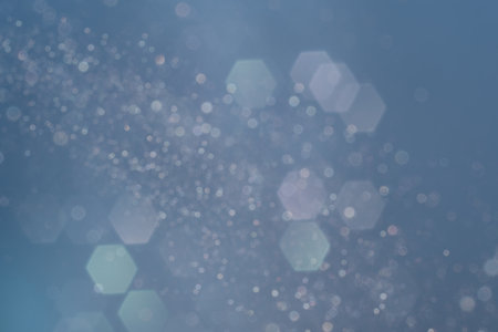 Blue vintage lights background. Silver, pink, green and blue defocused with glitter.