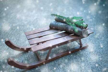 Sledge with Christmas presents in the snowfallの写真素材