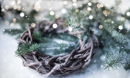 Christmas decoration background with garland lights and snowfall.の写真素材