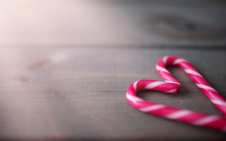 Beautiful christmas background of two candy canes in heart Shape. Copy space.の写真素材