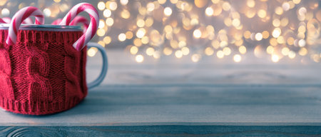 Candy canes in the red knitted mug. Copy cpace for your christmas ideas.の写真素材