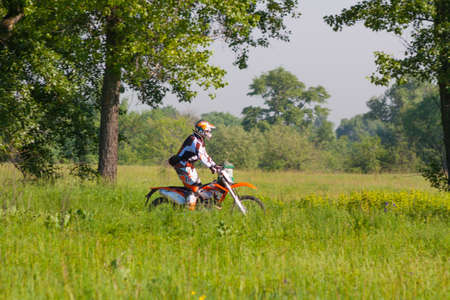 KIEV, UKRAINE - MAY 12: Motocross rider rides in the green areas of the Park Druzby Narodovのeditorial素材