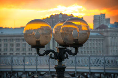 Rayed after sunset light on the background of the cityscape