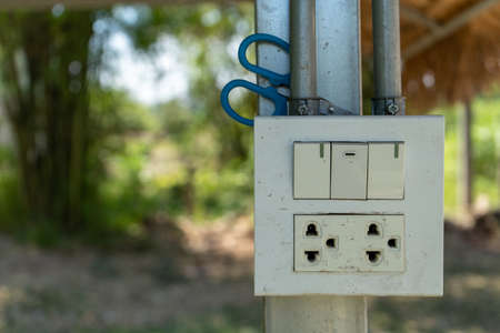 Close up of electric power socket in the park with blurred background.の写真素材