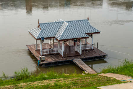 Wooden house on the bank of the river