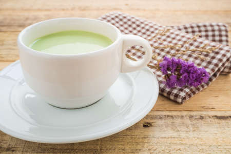 Milk green tea on wood table.の写真素材