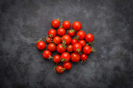 tomatoes on black background.の写真素材
