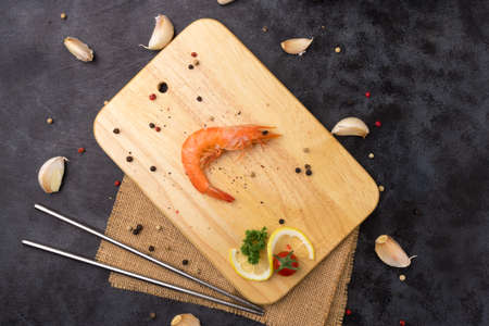 boiled shrimp on wood chopping.