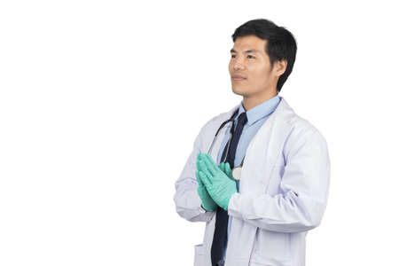 Isolated Asian male doctor stand for thank and welcome to greeting patient on white background. Health care and medical concept.の写真素材