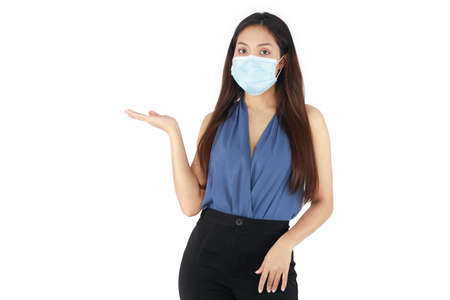 Isolated young Asian woman with long hair wearing a mask has been stressed and anxious from problemsの写真素材