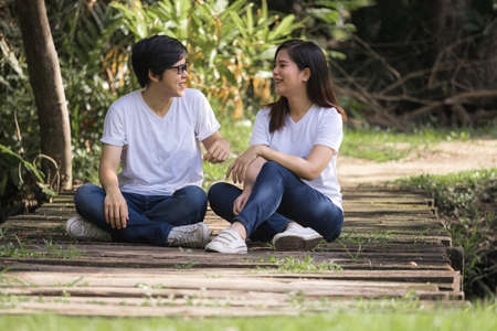 Lesbian couples doing activities and resting in the park on vacation. LGBT concept.の写真素材