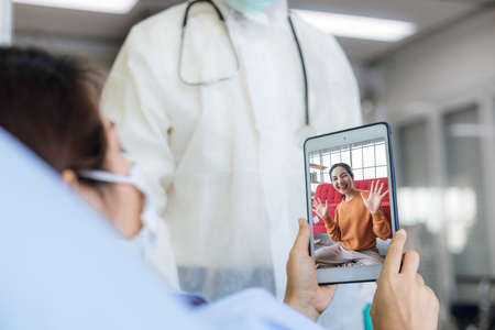 female patient in the detention center was in a video call with her daughter at home. Concepts of...