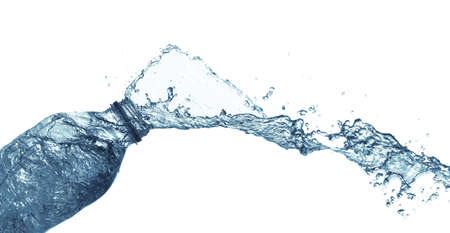 isolated of water splashing form the bottle on white background.の写真素材