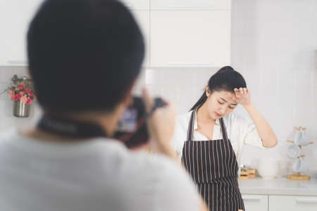 Photographers are shooting models in the concept of housewives doing food for families.の写真素材