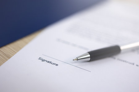 Close up pen is placed on top of the document with a space left for the signature.の写真素材