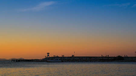 Land reclamation was sticking out of the side. Make things happen, many people flock together to appreciate the beauty of the scenery that can not be seen while on shore.の写真素材