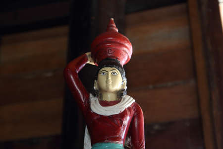 Statue of a woman carrying a container の写真素材