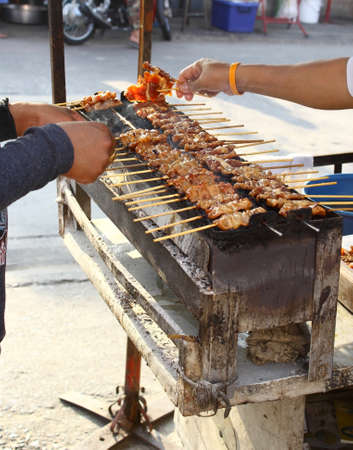 Pig roasting on a hot stove の写真素材