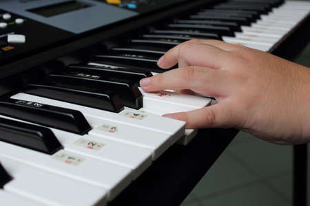 Kids play the keyboard の写真素材