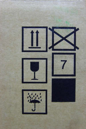 Fragile symbol on cardboard background