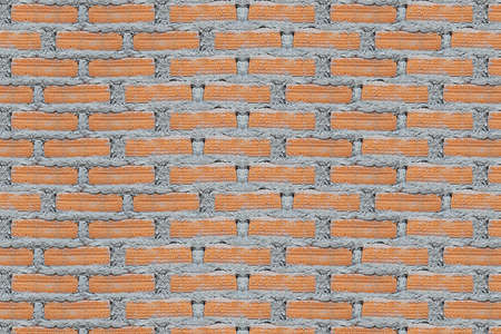 Background of wall of red bricks with cementの写真素材