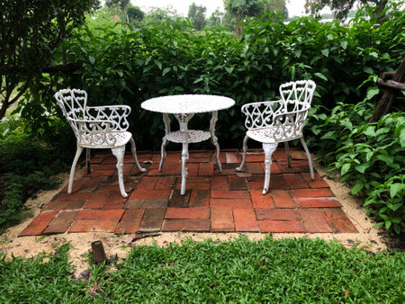 White table and chair in the garden,Thailand,Asia.の写真素材