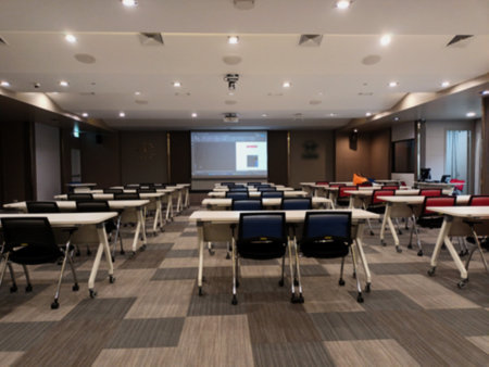 Interior of a conference room with white chairs and tables. Blurred backgroundの写真素材