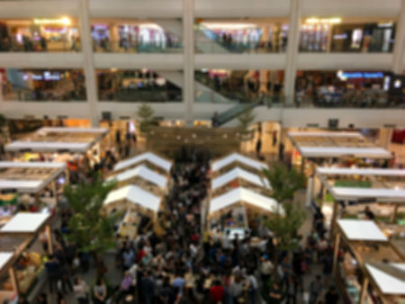 Blurred image of shopping mall and people for background usage. (blurred image)の写真素材