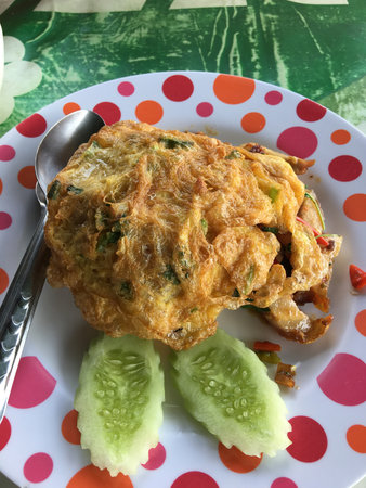Fried Egg omelet with cucumber, Thai food.