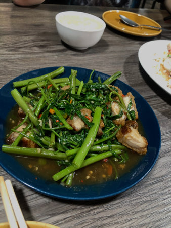 Stir-fried Water Spinach with Crispy Porkの写真素材