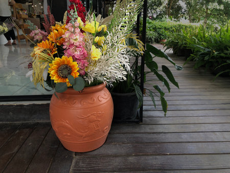 Flowers in a vase on the terrace of a cafeの写真素材