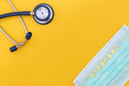 Coronavirus (COVID-19) testng concept, medical testing equipment on yellow background. Spece for...