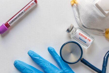 Covid-19 or coronavirus vaccine vial and syringe and Stethoscope and mask on white background. Medical conptの写真素材